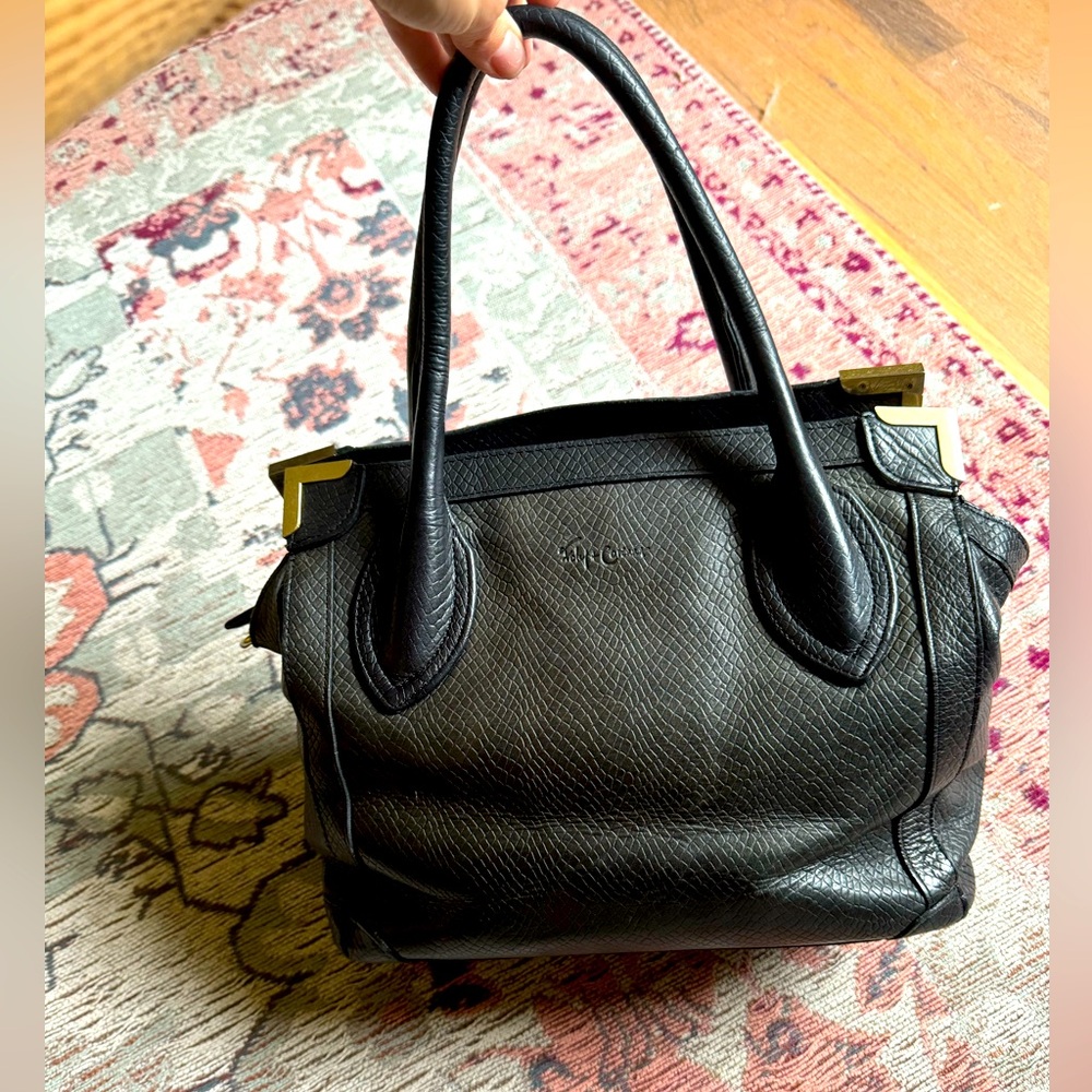 Foley and Corinna black leather purse!  Still in good condition!